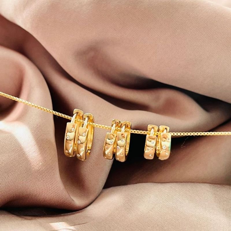 BRINCO ARGOLA COM PONTINHOS DE ZIRCONIAS M
