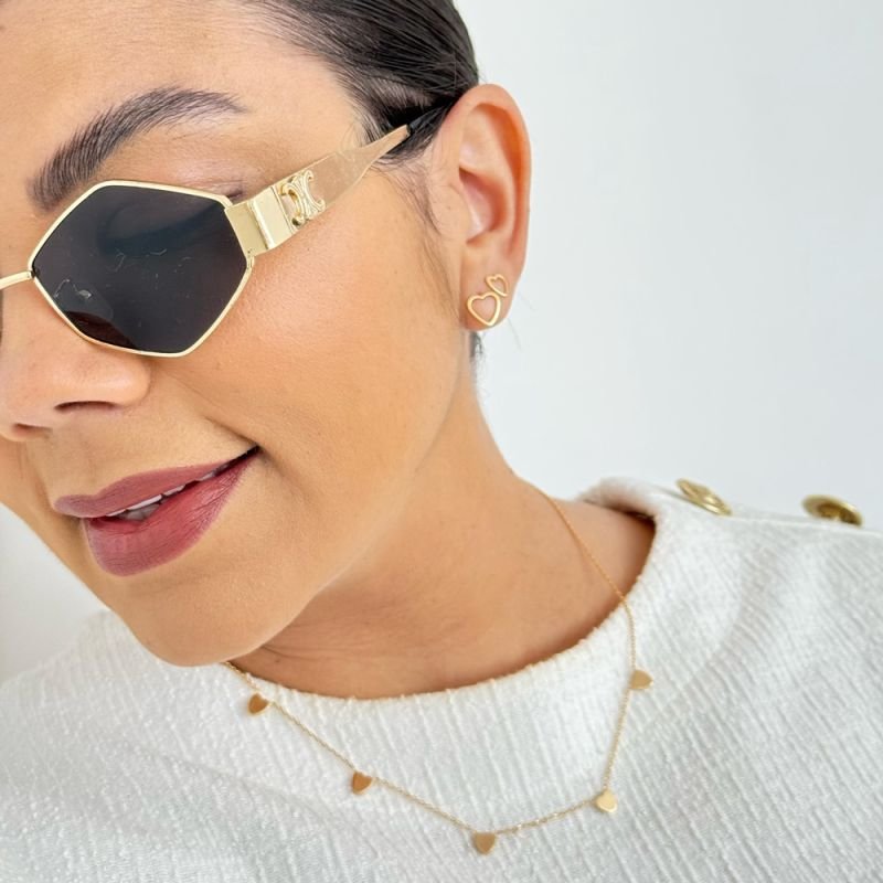 BRINCO CORAÇÃO VAZADO BORDA LISA M