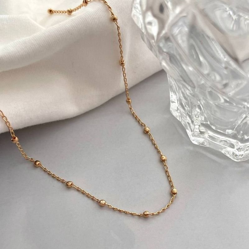 COLAR CHOKER DE BOLINHAS ESPAÇADAS